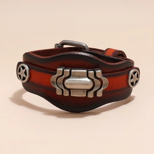 Detail of vintage layered cowhide leather bracelet with star rivets and pin buckle