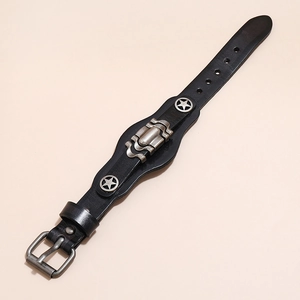 Detail view of black vintage leather bracelet featuring star studs and adjustable buckle