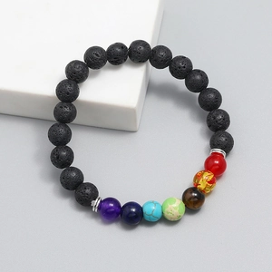 Handmade chakra bracelet with black lava stone and seven colored beads on white stone