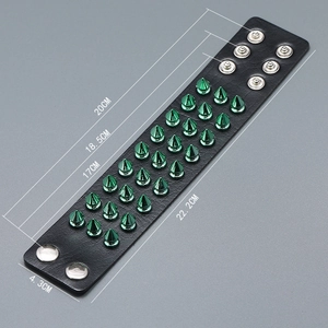Detail view of punk black leather bracelet with green metal spikes and size dimensions
