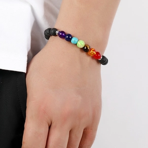Handmade 7 Chakra lava stone beaded bracelet for energy healing on a female wrist