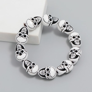 Gothic resin skull bead bracelet for men featuring ten white skulls with black facial details