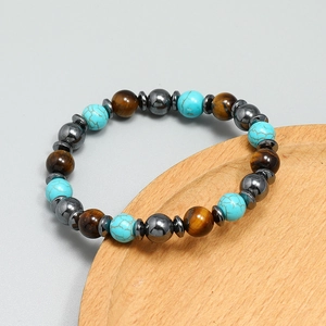Detail of beaded stretch bracelet with turquoise, tiger eye and hematite stones
