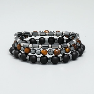 Set of four men's beaded bracelets featuring matte black onyx and brown tiger eye stones