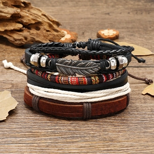 Handmade vintage multilayer leather bracelet set with ethnic feathers and tribal woven cords