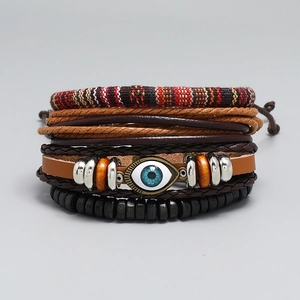 Macro detail of Bohemian multilayer leather bracelet set with Evil Eye charm and beads