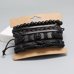 Retro 4-piece woven leather bracelet set with skull charms and black beads for men