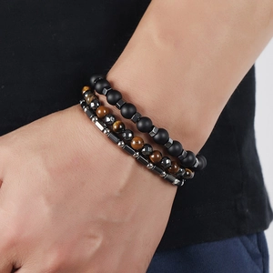 Three-piece men's bracelet set with tiger eye, matte black beads and hematite cylinders