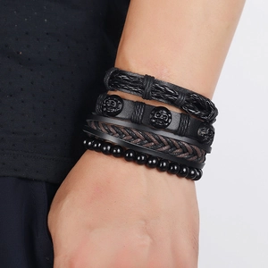 Set of 4 vintage braided leather bracelets with skull charms and black beads for men