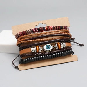 Multilayer leather bracelet set with evil eye bead and woven straps on display