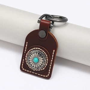 Handmade vintage brown leather keychain with silver buckle and turquoise stone decoration