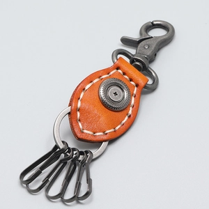 Handmade orange cowhide leather keychain with vintage metal clips and white stitching