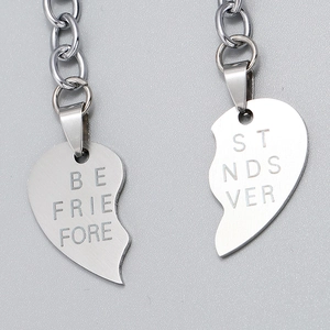 Macro shot of stainless steel Best Friends Forever interlocking heart necklace pendants