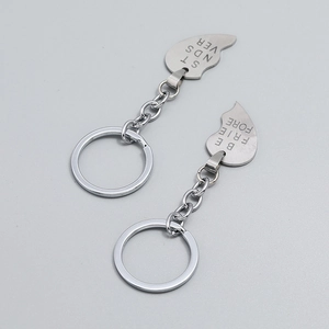 Macro view of heart-shaped puzzle keychains with Best Friends Forever engraving