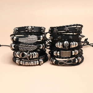 Men's punk leather bracelet set with silver skull, feather, and star charms