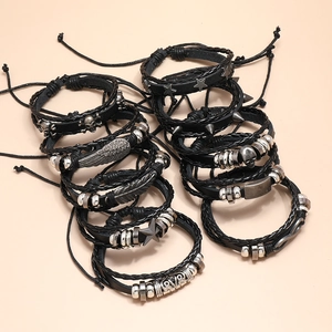 Men's punk leather bracelet set with skull, feather charms and silver spikes