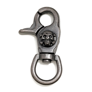 Vintage silver rotating lobster clasp with a skull design for bags and keychains