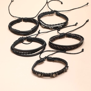Five-piece vintage multilayer woven leather bracelet set with retro skull and star charms