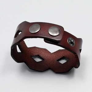 Retro wide dark brown leather bracelet with hollow diamond pattern and snap button