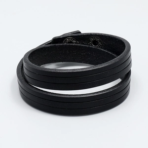 Close-up of black layered genuine leather bracelet with metal snap button closures