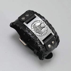 Detail of Viking Thor hammer leather bracelet featuring Elder Futhark Runes and metal studs