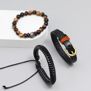 Three-piece retro woven leather bracelet set with wooden beads and yin yang charm