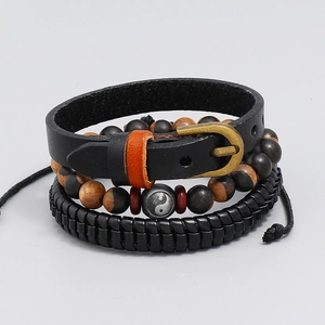 Detailed view of 3-piece vintage men's leather bracelet set with Yin Yang bead and wood beads