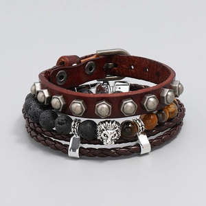 Detail of men's leather bracelets with tiger eye stone and silver lion head charm
