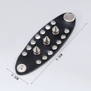 Punk leather ring with double-row silver rivets and sharp metal spikes from a top view