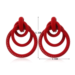Detail of red tiered geometric hoop earrings with textured finish, size 5.2cm x 4.0cm