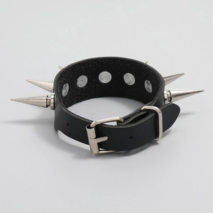 Close-up of black leather punk bracelet featuring metallic silver spikes and buckle detail