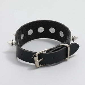 Punk style black leather bracelet with silver spiked rivets and adjustable metal buckle