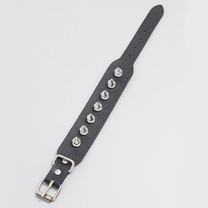 Punk style black leather bracelet featuring seven silver metallic cone spikes with buckle