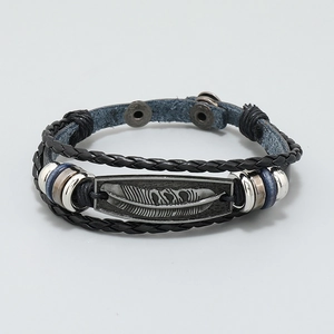 Mens vintage black multilayer leather bracelet with a carved metal feather charm