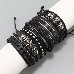 Men's 6-piece black leather bracelet set with skull and star charms on display