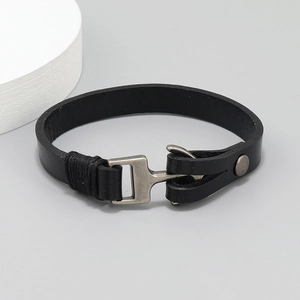 Detail of vintage black leather anchor bracelet featuring silver alloy hook clasp