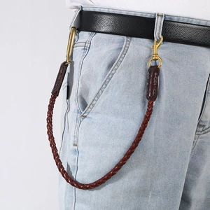 Vintage woven leather wallet chain for jeans featuring brass hooks and a retro biker style