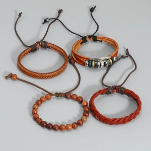Handmade four-piece vintage leather bracelet set with wooden beads and metal accents