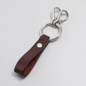 Retro brown leather keychain with silver metal ring and S-hooks in punk industrial style