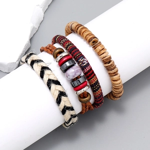 4-piece bohemian handmade woven bracelet set with ethnic beads and vintage leather charms