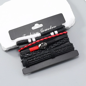 4-piece Bohemian punk leather bracelet set featuring skull charm and woven cords