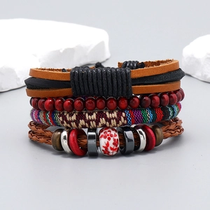 Detailed macro view of four-layer handmade bohemian bracelet with leather and ceramic beads