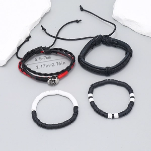 Detail of 4-piece set showing bohemian woven leather bracelets and black-white beaded bands
