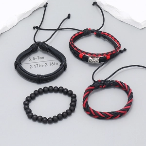 Detail of 4-piece handmade bohemian multilayer leather bracelet set with beaded textures