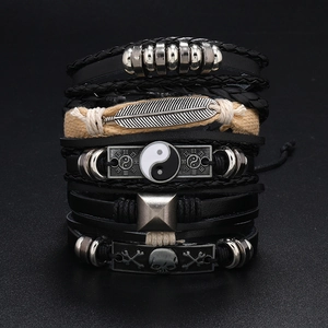 Men's vintage multilayer leather bracelet set with feather, skull, and tai chi charms