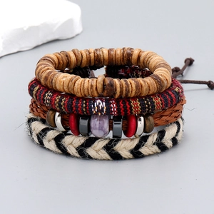 Detail of four-piece Bohemian multi-layer handmade woven bracelets with ethnic wood beads