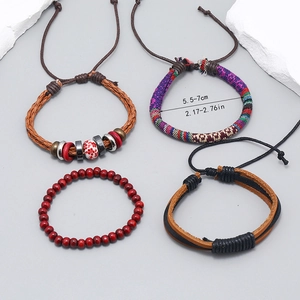 Detail of 4-piece Bohemian handmade woven bracelet set with beads and leather cords