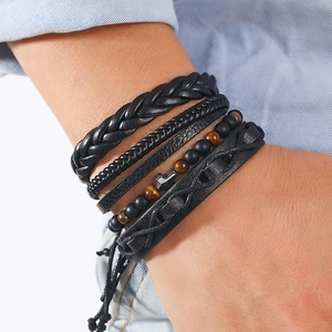 Three-piece black layered leather bracelet set with tiger eye beads and cross charm