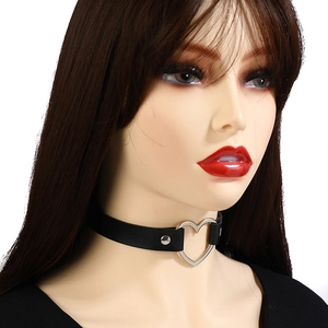 Detail view of a black punk leather choker featuring a large silver heart-shaped metal buckle