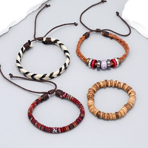 Handmade bohemian 4-piece woven bracelet set with ethnic beads and adjustable cords